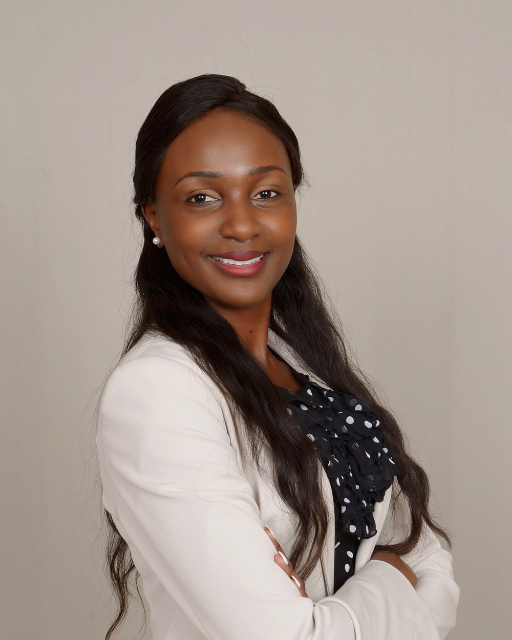 Grace Anyenya smiling in a professional portrait
